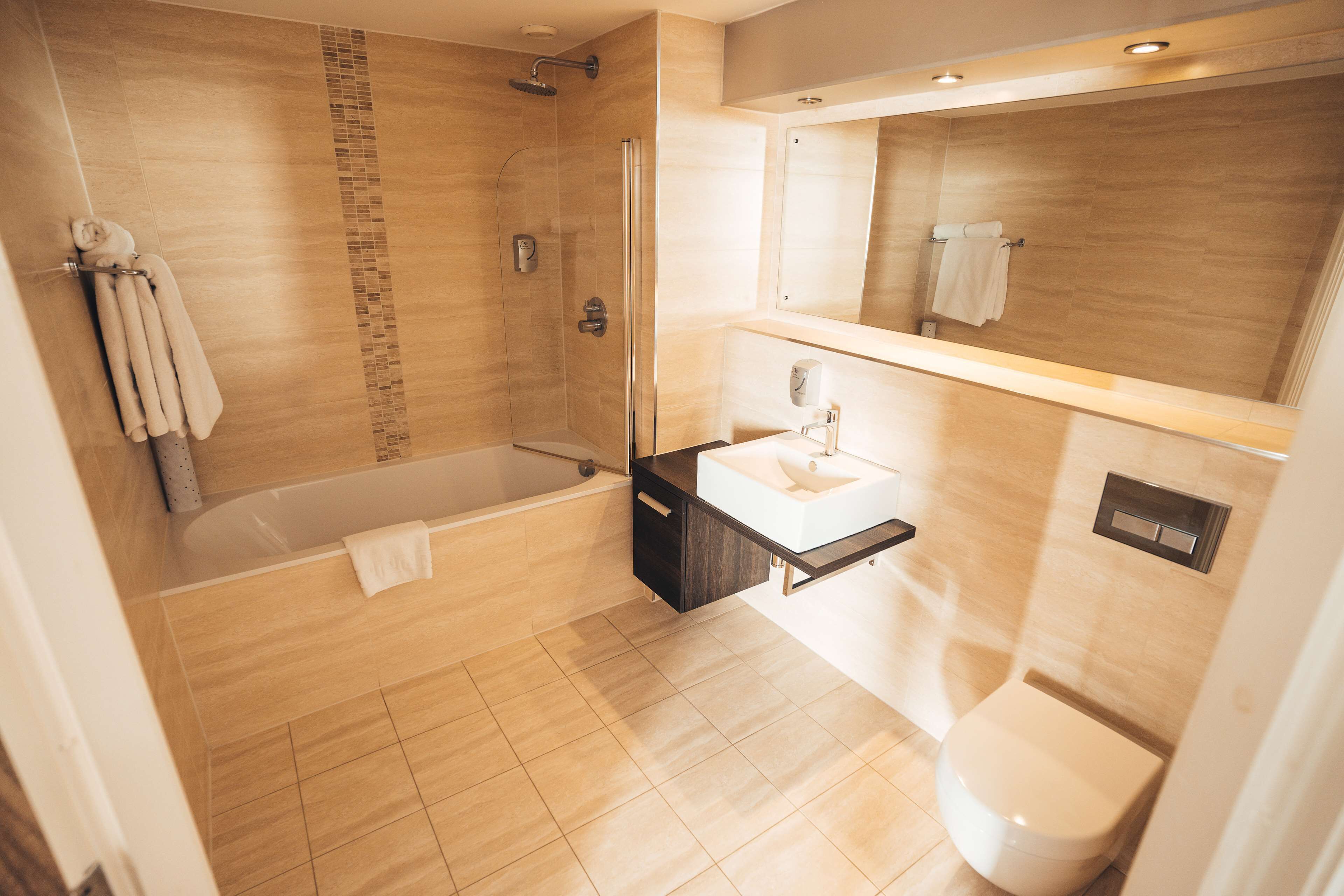 bathtub, free toiletries, hair dryer, towels