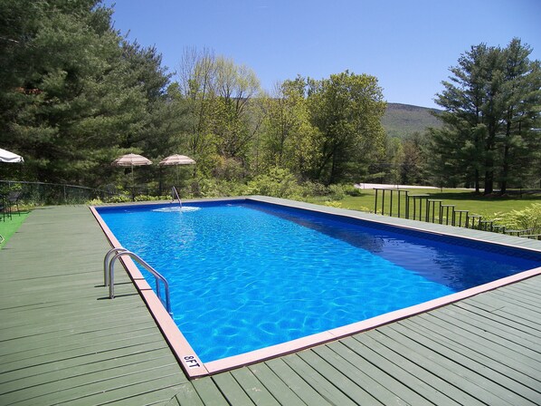 Seasonal outdoor pool, pool umbrellas, pool loungers