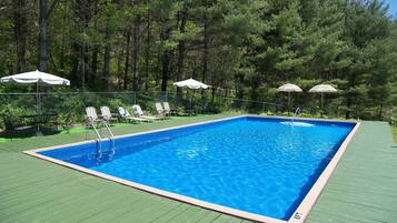 Seasonal outdoor pool, pool umbrellas, sun loungers