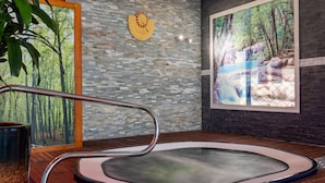 A spa area with a hot tub, wooden flooring, a wall clock, and a large window with a forest view. - Best Western Hotel & SPA Pau Lescar Aeroport (Lescar)