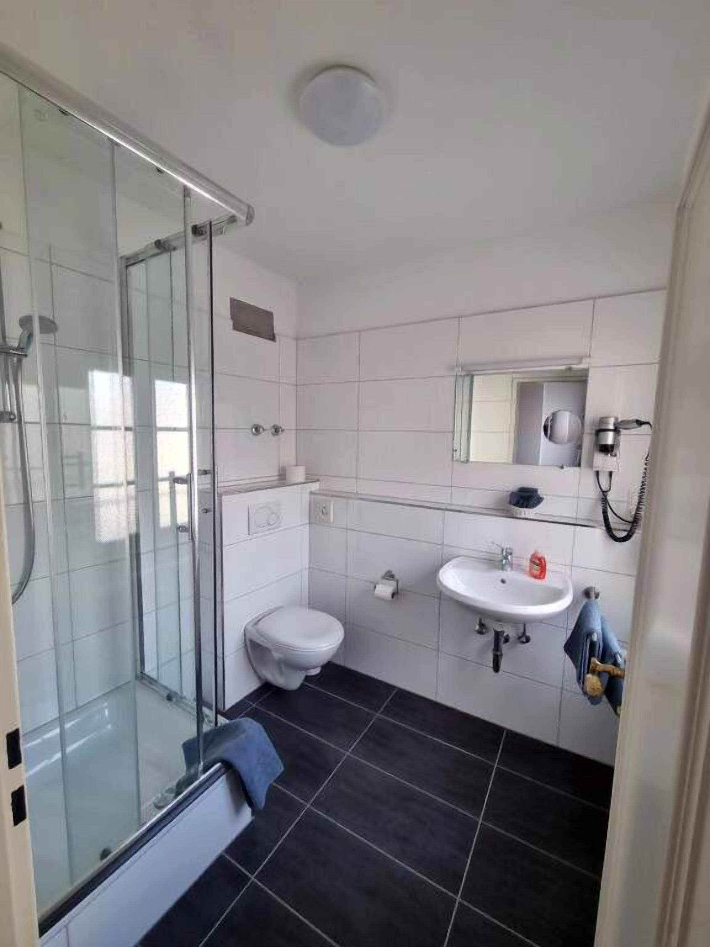 comfort double room, 1 king bed | bathroom | eco-friendly toiletries, hair dryer, towels, soap