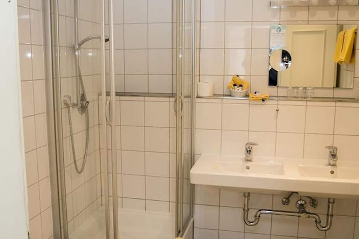 standard quadruple room, non smoking | bathroom | eco-friendly toiletries, hair dryer, towels, soap