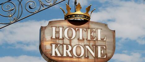 A hotel sign with a crown and the name "HOTEL KRONE".