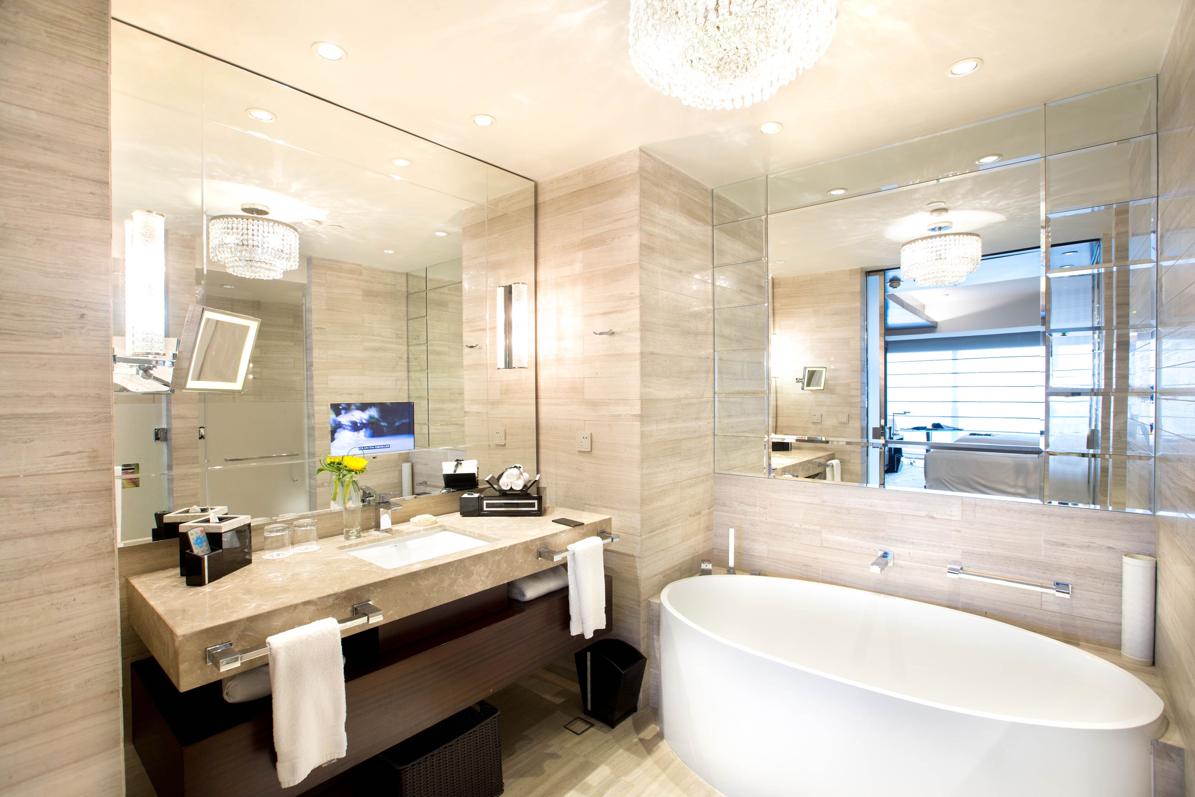 deep-soaking bathtub, rainfall showerhead, designer toiletries