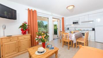 Comfort Apartment | Living area | Flat-screen TV