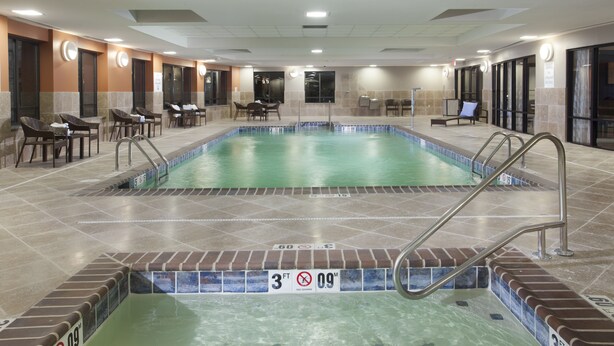 An indoor swimming pool with lounge chairs and a no diving sign. - Holiday Inn Express Hotel & Suites Morgan City Tiger Island by IHG (Morgan City)