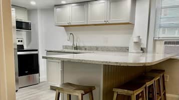 Family Apartment, Multiple Beds, Kitchen | Private kitchen | Mini-fridge