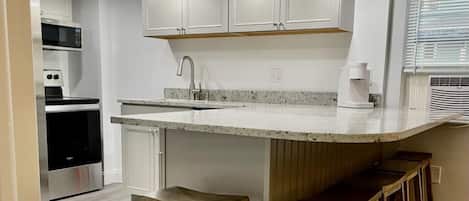 Family Apartment, Multiple Beds, Kitchen | Private kitchen | Mini-fridge