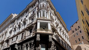 A historic building with ornate architectural details, including columns and decorative moldings. -  Dharma Luxury Hotel & Spa. (Rome)