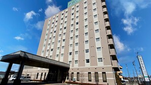 A multi-story hotel with a prominent sign at the top. - Hotel Route-Inn Sendai Taiwa Inter (Taiwa)