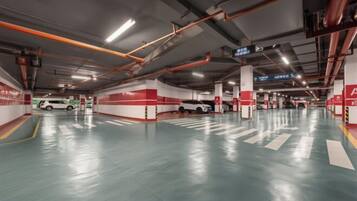 A multi-level parking garage with clear signage, multiple parking levels, and a clean, well-lit environment.