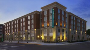 A multi-story hotel with a brick facade, large windows, and a prominent sign indicating it is a Homewood Suites. - Homewood Suites by Hilton Columbus/OSU, OH (Columbus)