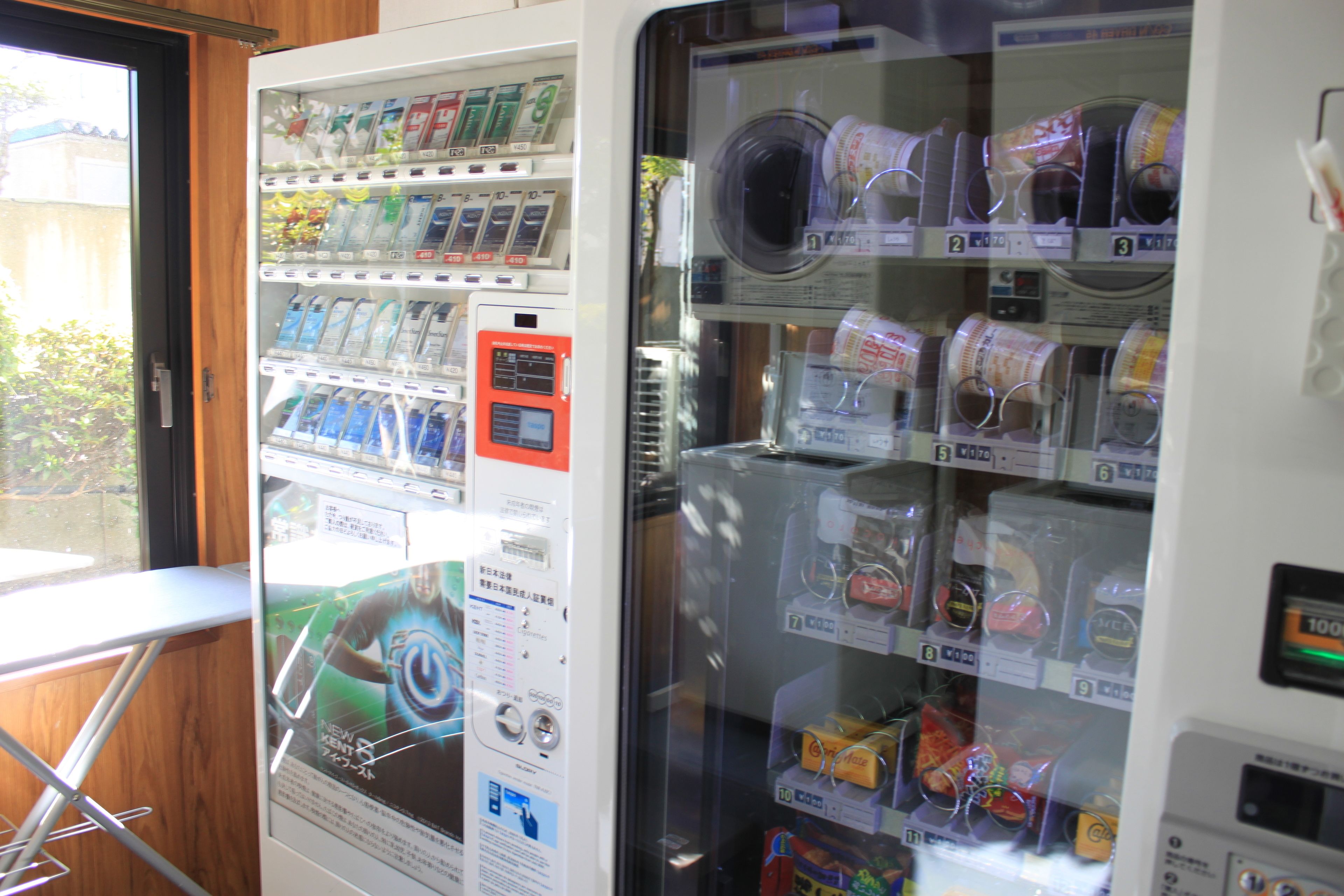 A vending machine with various items including snacks and beverages.