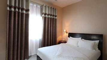 ดีลักซ์อพาร์ทเมนท์, 1 ห้องนอน, สูบบุหรี่ได้, วิวเมือง | 1 ห้องนอน, เครื่องนอนระดับพรีเมียม, เตียงพร้อมฟูกเสริมที่นอน