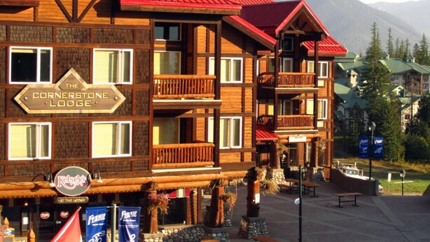 The Cornerstone Lodge with multiple balconies and a sign indicating it's a lodge.