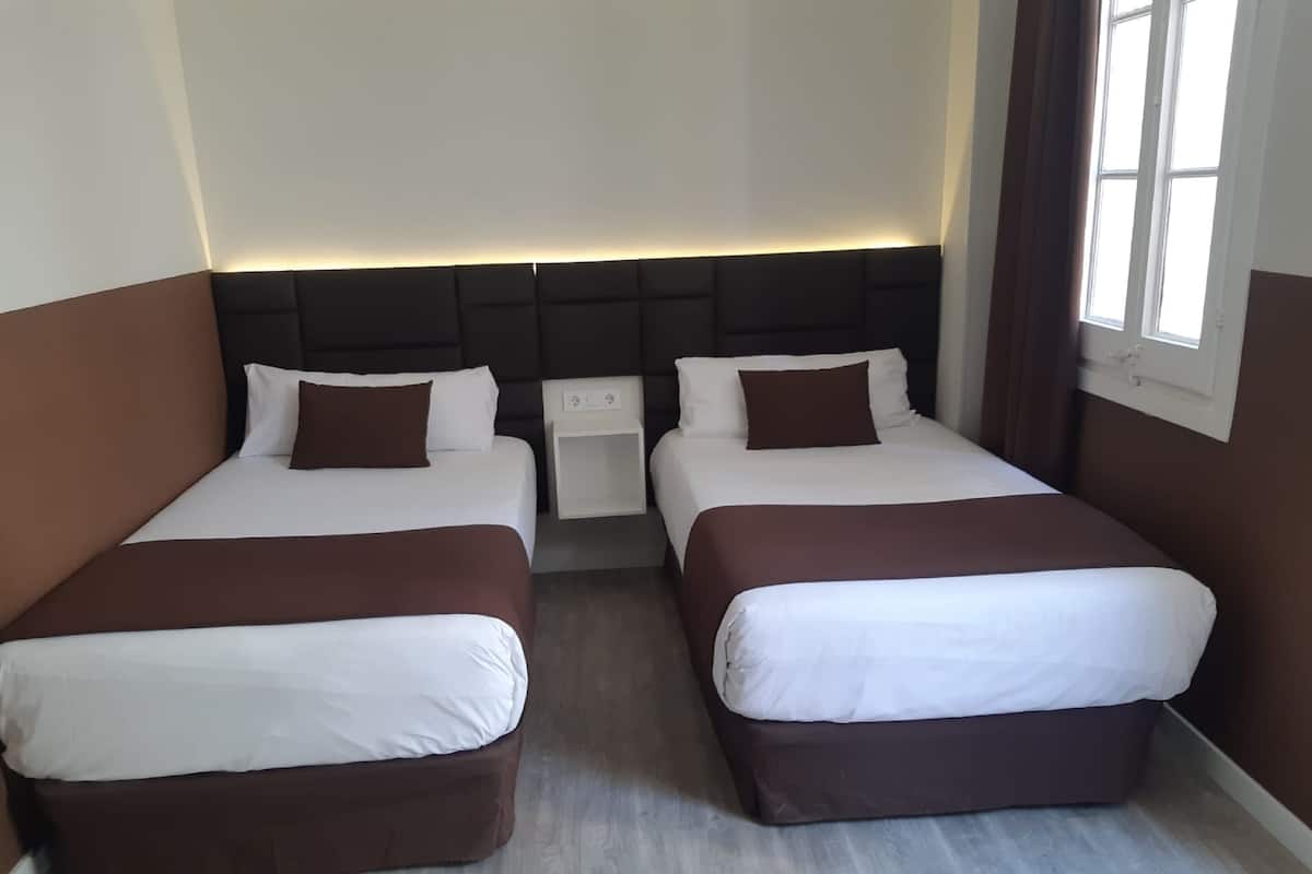 Twin kamer | Verduisterende gordijnen, gratis wifi, beddengoed