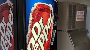 A Dr Pepper vending machine in a commercial setting. - Motel 6 New Boston, TX (New Boston)