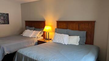 Room, 1 King Bed & 1 Queen Bed | In-room safe, desk, iron/ironing board, free WiFi
