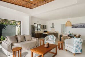 Stylia Villa Premium Beachfront | Living area | 42-inch flat-screen TV with satellite channels, TV, DVD player - Stylia Villas (Trou d'Eau Douce)