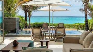 Stylia Villa Premium Beachfront | Living area | 42-inch flat-screen TV with satellite channels, TV, DVD player