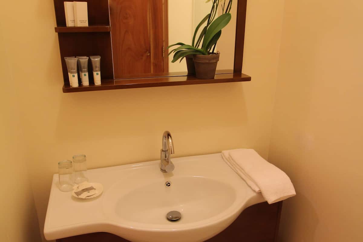 room, multiple beds, pool view | bathroom sink