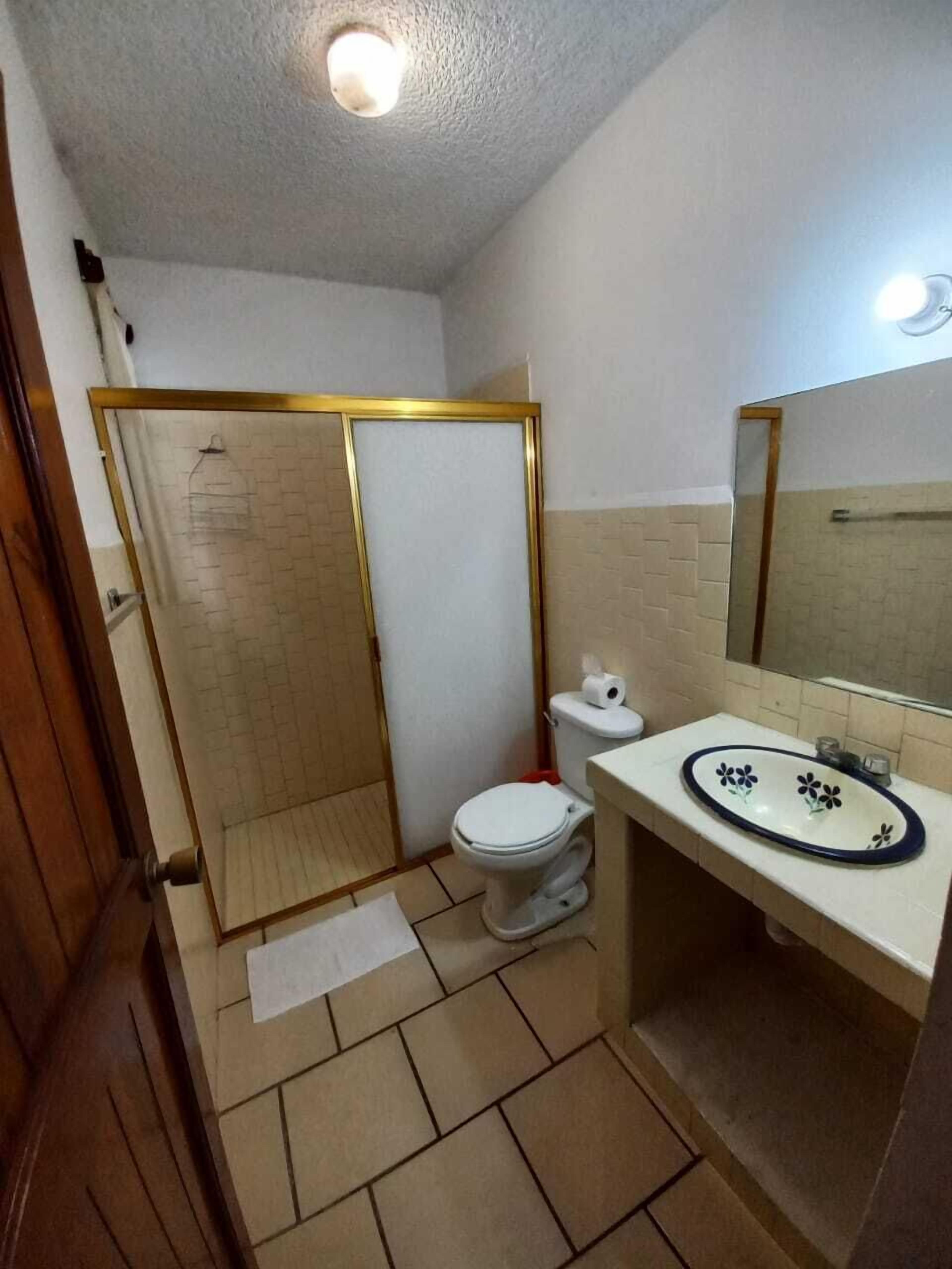 quadruple room | bathroom | shower, towels, soap, toilet paper