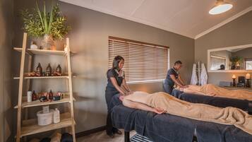 Experience relaxation in this serene spa setting with two massage tables and calming ambiance.