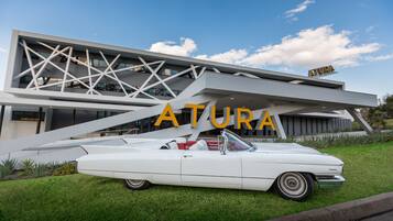 A modern building with the name 'ATURA' prominently displayed.