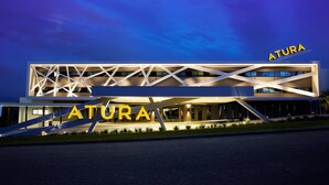A modern building with the name 'ATURA' prominently displayed on the facade. - Atura Blacktown (Prospect)