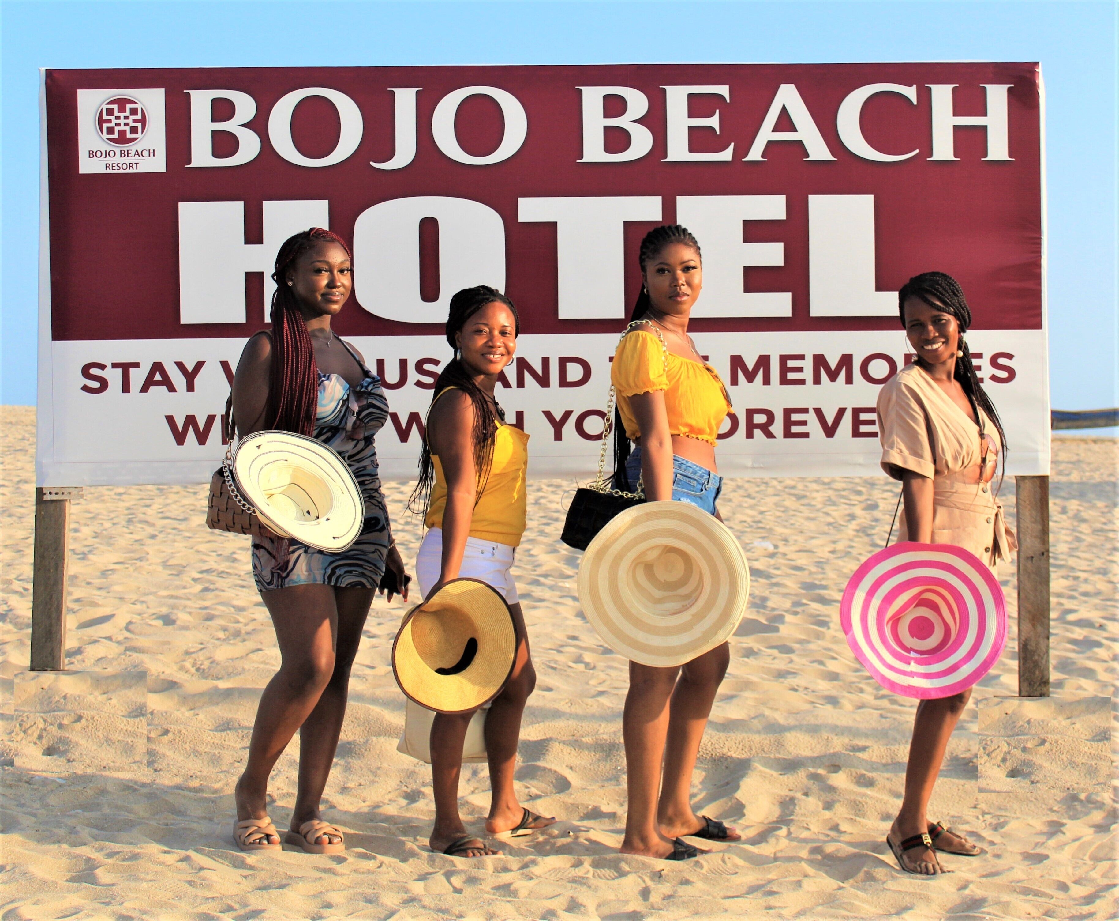 A sign for the Bojo Beach Hotel with a message about staying and making memories.