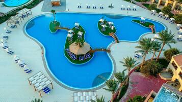 7 outdoor pools, open 7:00 AM to 5:00 PM, pool umbrellas, pool loungers