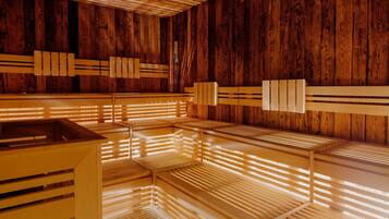 A sauna with wooden benches and slatted walls.