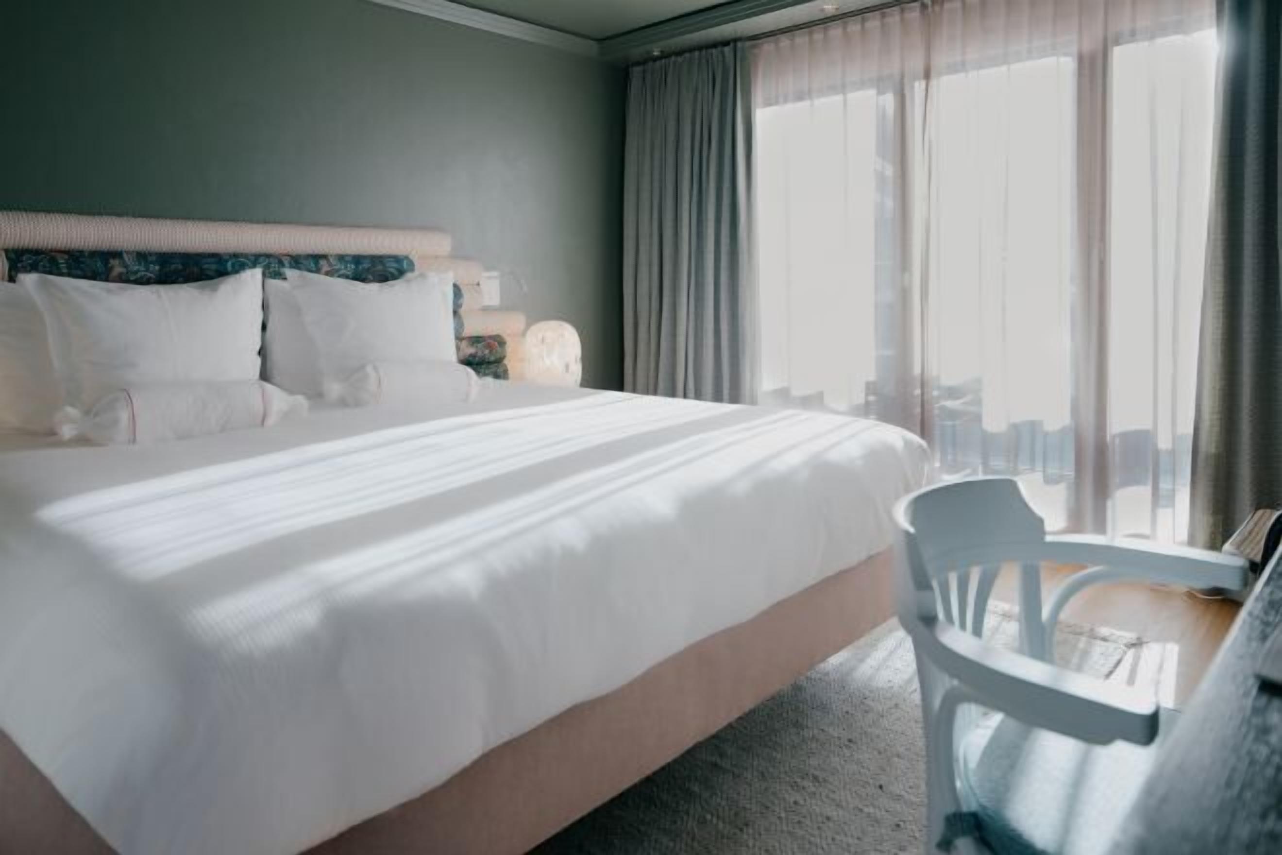 Hypo-allergenic bedding, down comforters, minibar, in-room safe