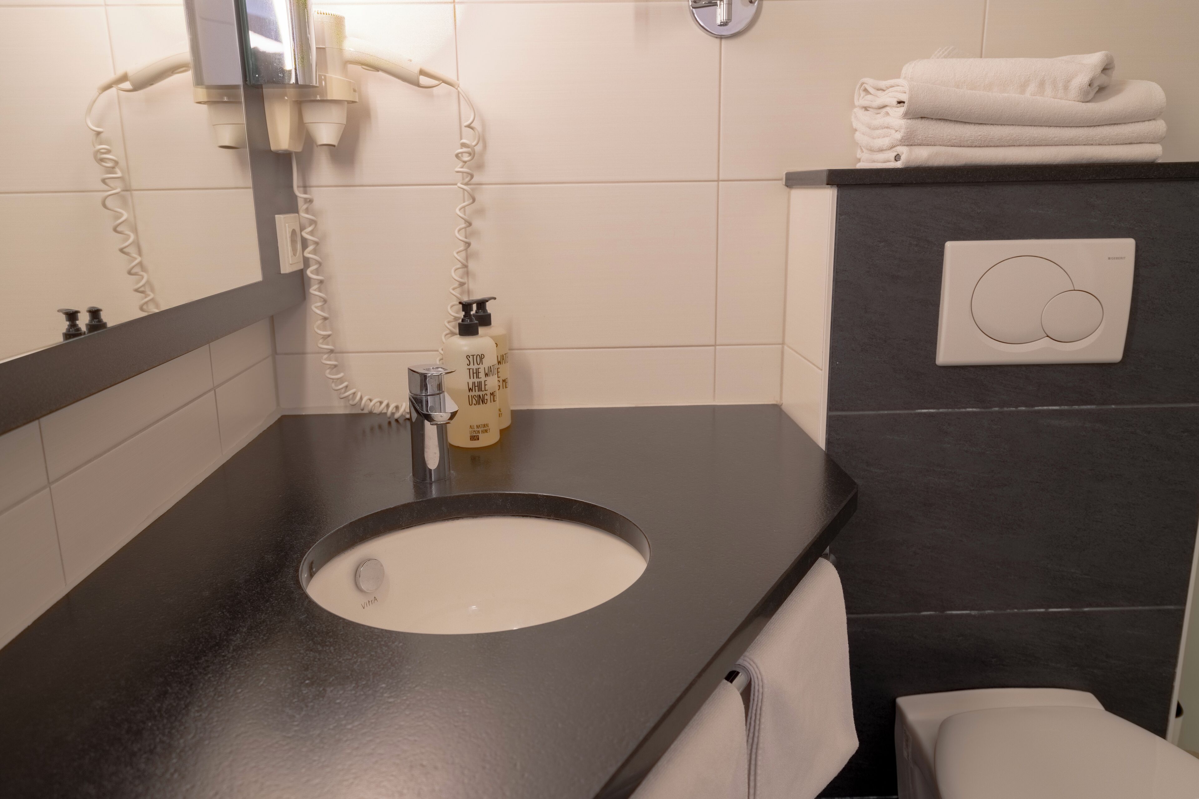 shower, eco-friendly toiletries, hair dryer, towels