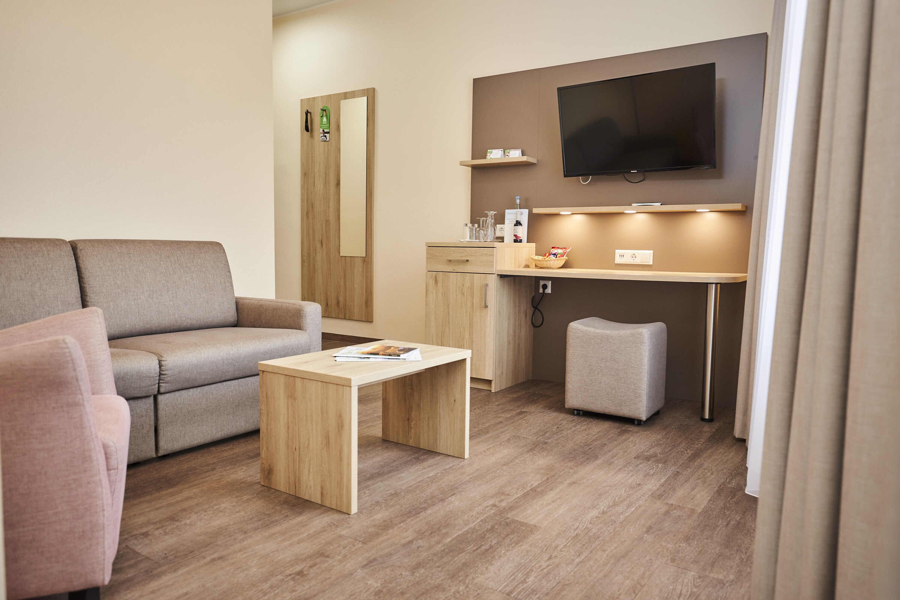 junior suite | living area | flat-screen tv