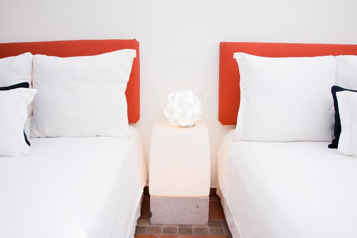 Premium bedding, down comforters, in-room safe, soundproofing