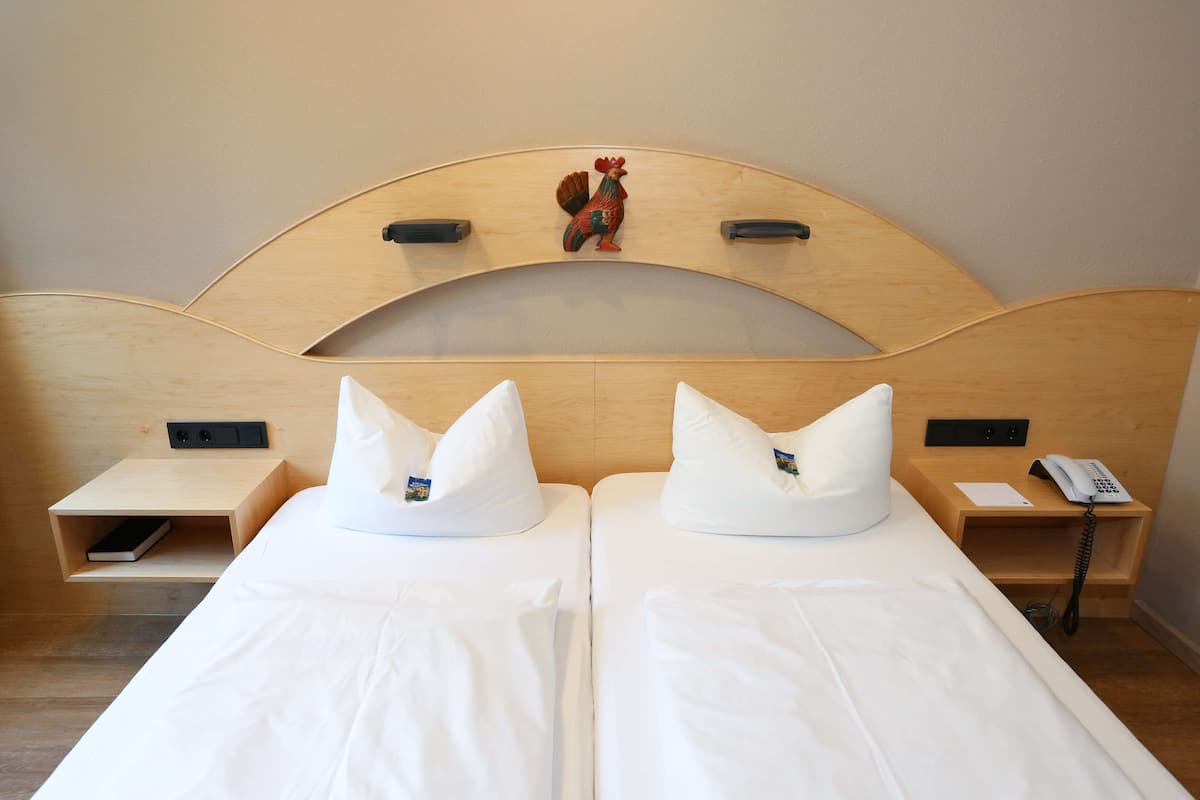 Hypoallergeen beddengoed, een minibar, een bureau, een laptopwerkplek