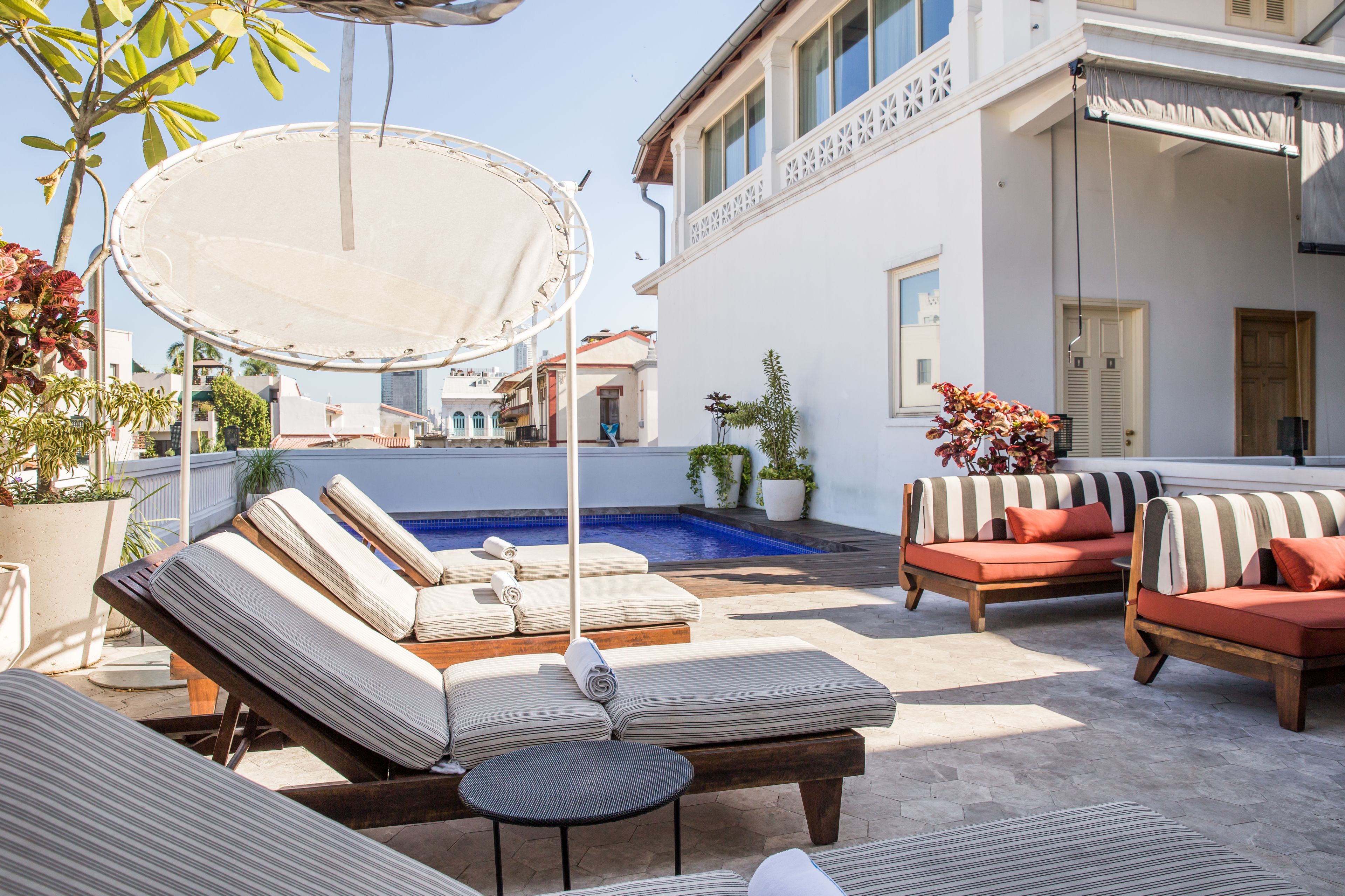 outdoor pool, pool umbrellas, pool loungers