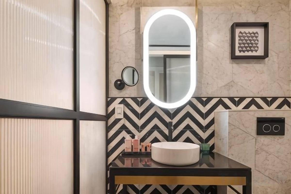 Designer toiletries, hair dryer, bathrobes, slippers