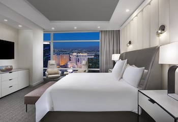 A nighttime cityscape with prominent buildings including the Planet Hollywood and the MGM Grand. at ARIA Sky Suites