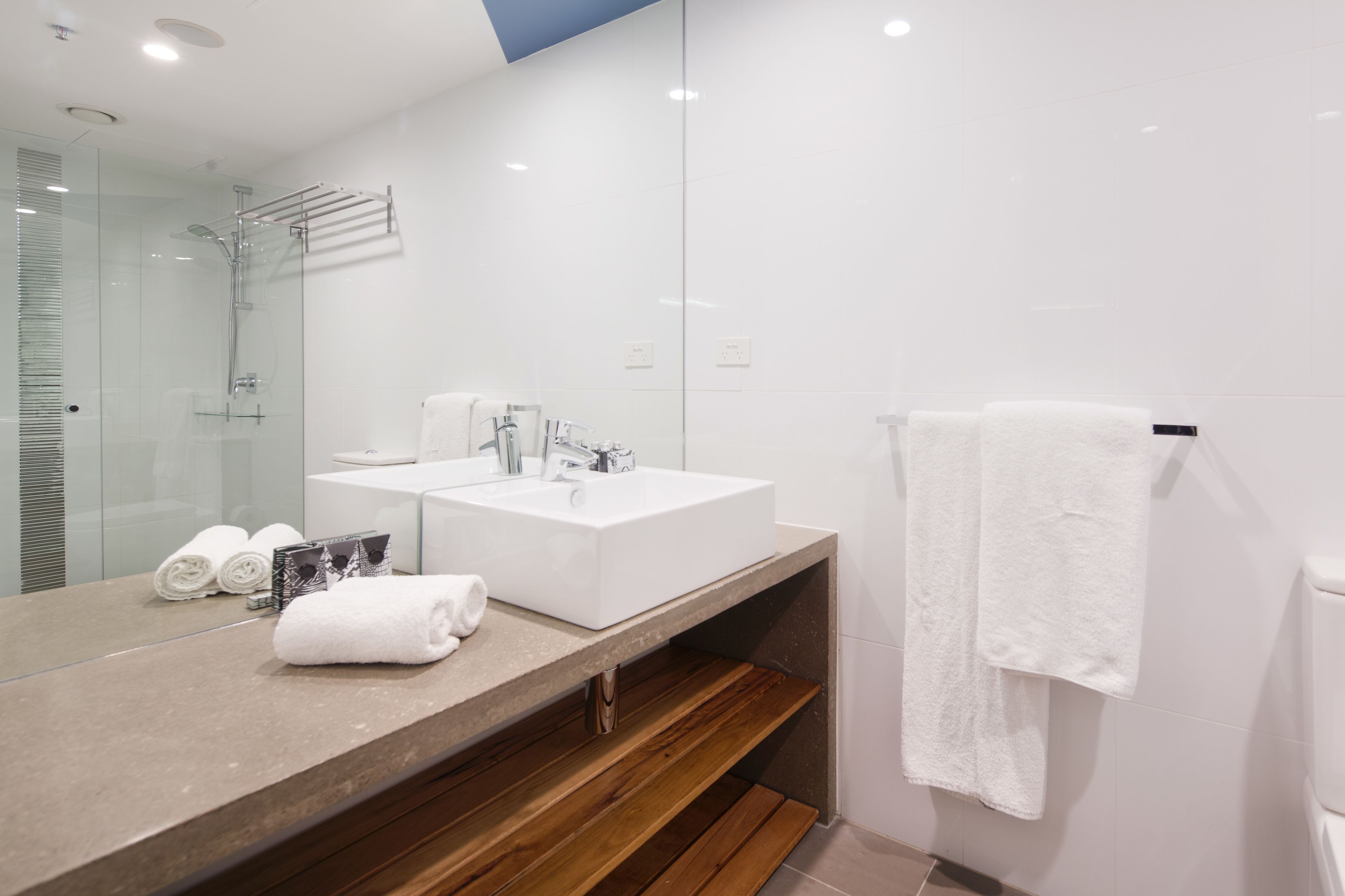 superior suite, 1 king bed | bathroom | designer toiletries, hair dryer, slippers, towels
