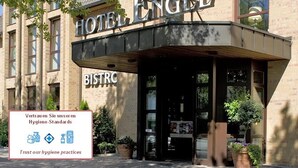 A hotel entrance with a sign reading "HOTEL ENGEL" and a "BISTRO" sign below. - Hotel Engel (Hamburg)
