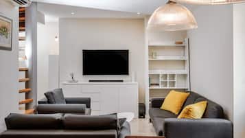 Deluxe Apartment | Living area | 125-cm LCD TV with cable channels, TV