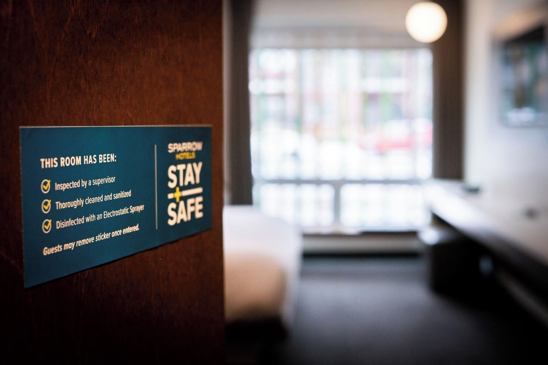 A sign indicating room safety measures including inspection, cleaning, and disinfection.