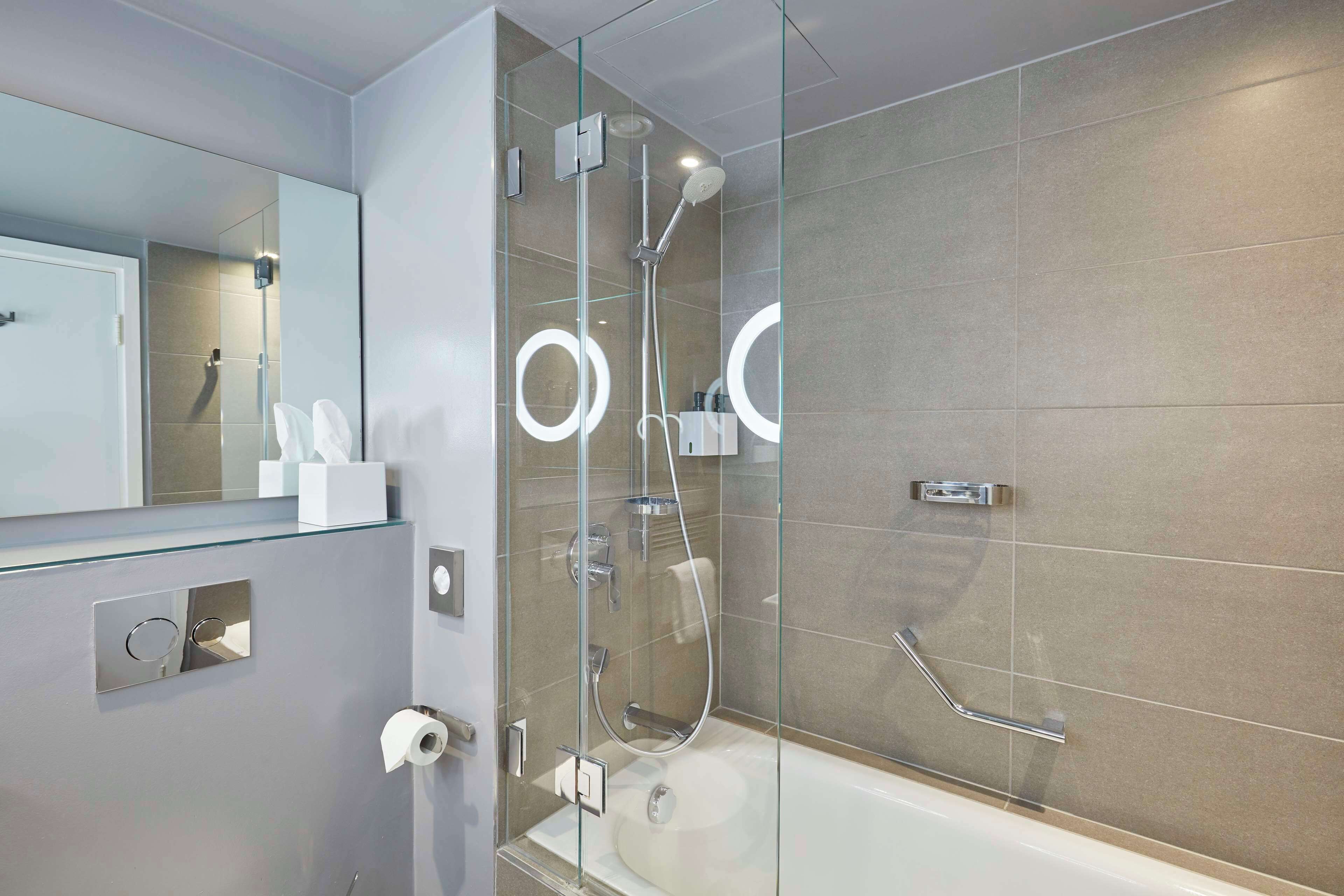 designer toiletries, hair dryer, towels