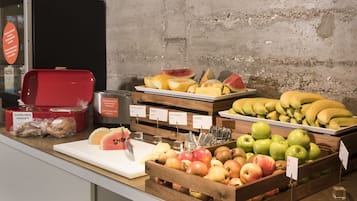 A variety of fruits and gluten-free products on display in a store.