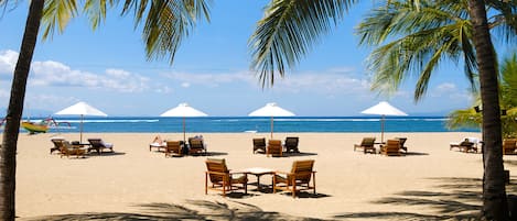 On the beach, white sand, free beach cabanas, sun-loungers