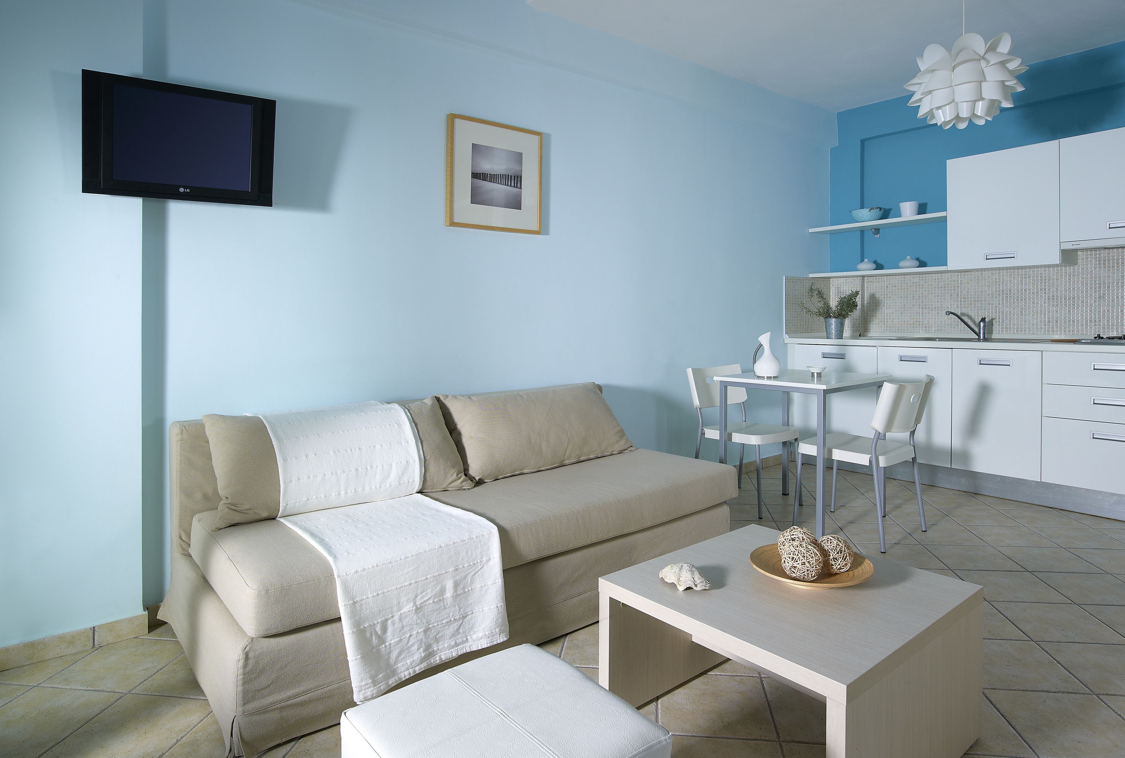 Deluxe Apartment, Pool View | Living area | LCD TV