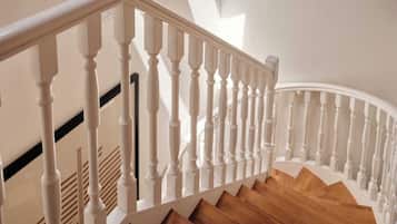 A staircase with white balusters and wooden steps.