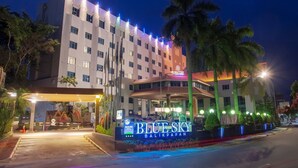 A hotel entrance with a sign reading "BLUE SKY BALIKPAPAN" and a well-lit facade. - Blue Sky Hotel (Balikpapan)